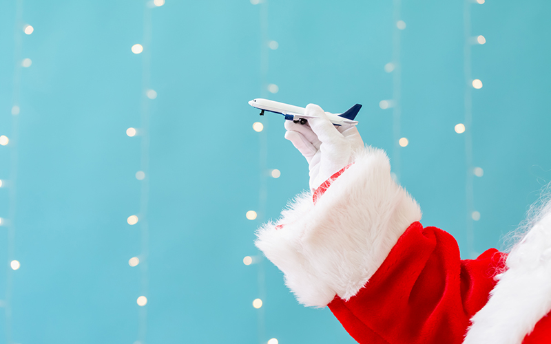 Santa holding a plane