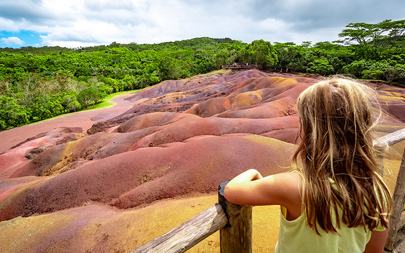 Girl looking out over Seven Coloured Earth Geopark in Mauritius