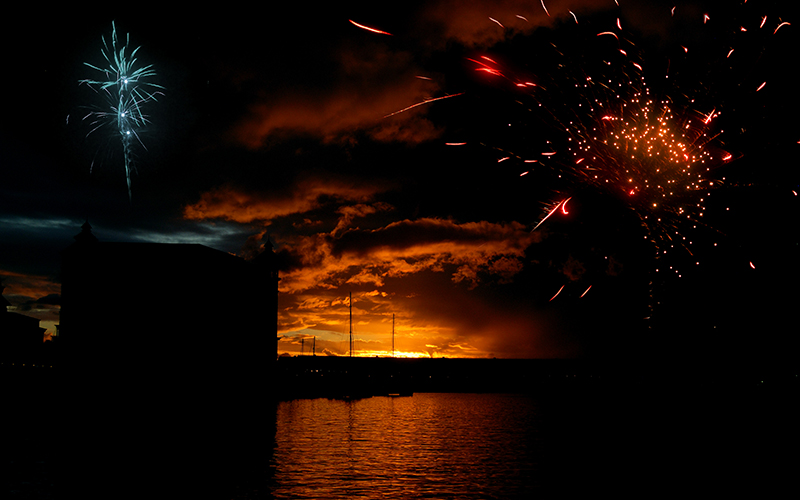 Fireworks at sunset over the waters of Port Louis in Mauritius
