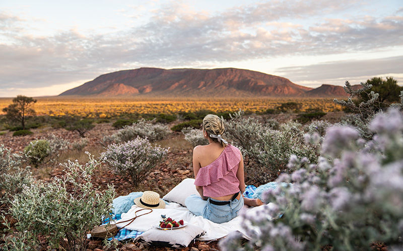 Woman picnicking at Mount Augustus